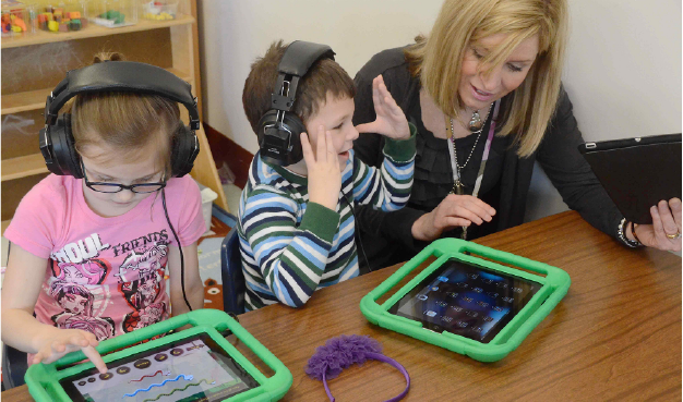 Kindergarten teacher with Students on iPads
